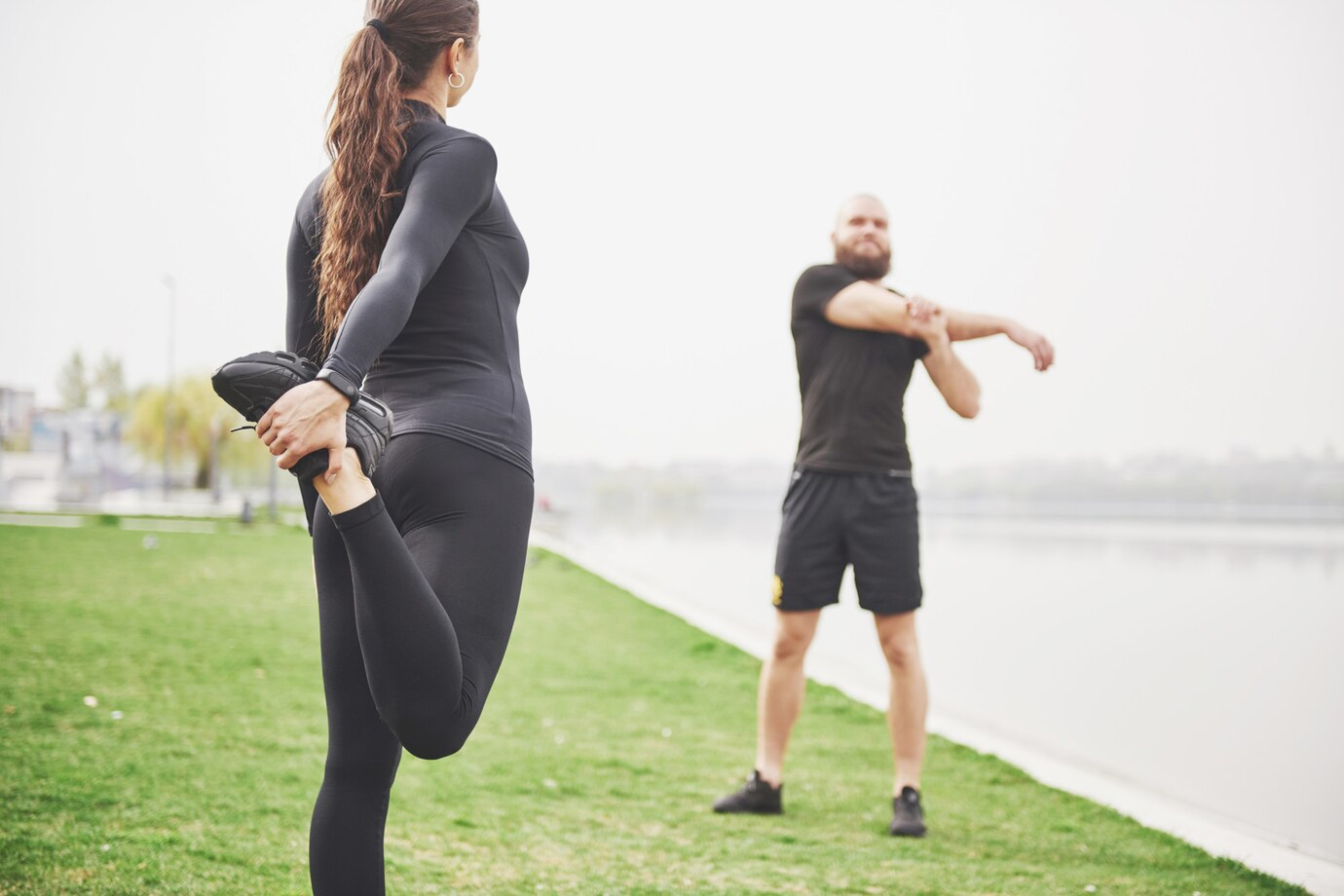 Therapy and Rehabilitation fitness couple stretching outdoors park near water young bearded man woman exercising together morning 146671 14790